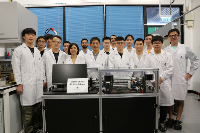 Prof. Sun Qingping (front row, fourth left), Prof. Yao Shuhuai (front row, third left), both Professors of Department of Mechanical and Aerospace Engineering (MAE), MAE Postdoctoral Research Associate Dr. Zhou Guoan (front row, second left), MAE PhD student Li Zexi (front row, first left), and other members of the research team with their elastocaloric air conditioner. 