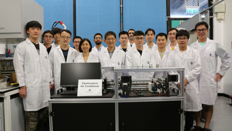 Prof. Sun Qingping (front row, fourth left), Prof. Yao Shuhuai (front row, third left), both Professors of Department of Mechanical and Aerospace Engineering (MAE), MAE Postdoctoral Research Associate Dr. Zhou Guoan (front row, second left), MAE PhD student Li Zexi (front row, first left), and other members of the research team with their elastocaloric air conditioner. 