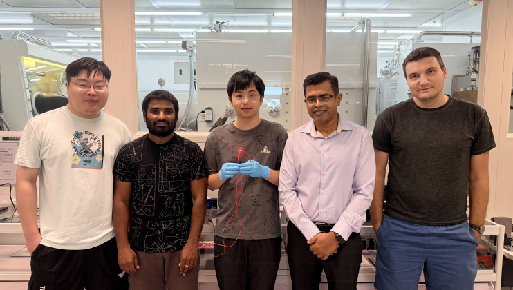 Group photo of the research team: Prof. Abhishek K. Srivastava (second right), corresponding author of the study; Liao Zebing (center), PhD student and first author of the study; as well as co-authors including postdoctoral fellow Dr. Maksym Prodanov (first right), PhD students Mallem Kumar (second left) and Song Jianxin (first left). Mr Liao holds a red emitting QR-LED sample.