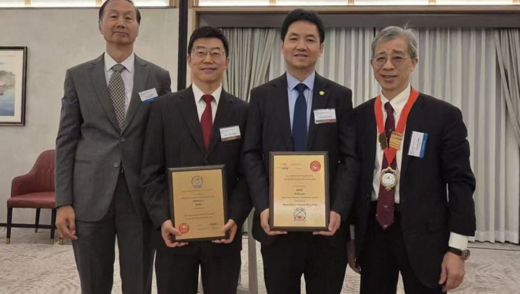 Newly elected HKAE Fellows Prof. Fan Zhiyong (second right) and Prof. Zhang Limin (second left), along with Ir Dr. Alex Chan Siu-Kun (first right), HKAE President, and Prof. Kwok Hoi-Sing, Visiting Professor of the Department of Electronic and Computer Engineering and also HKAE Fellow.
