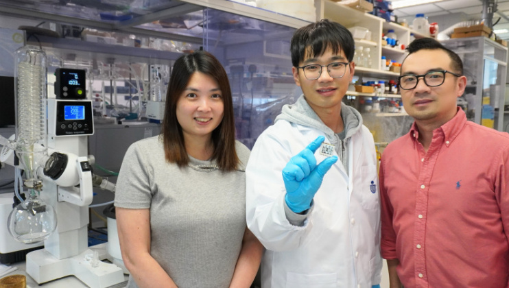 Dr. Chang Xiaoming (center) holds his record-breaking perovskite solar cells with Prof. Lin Yen-Hung (right) and Dr. Fion Yeung (left).